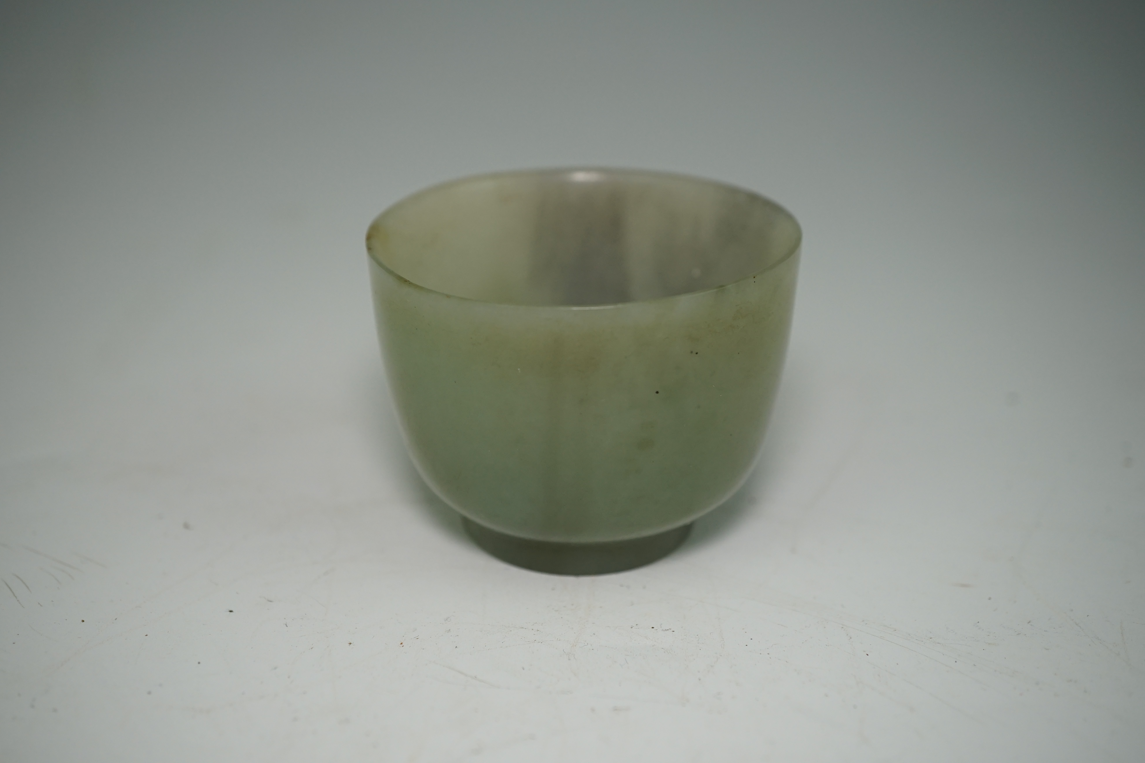 A Chinese pale celadon jade cup, 18th / 19th century